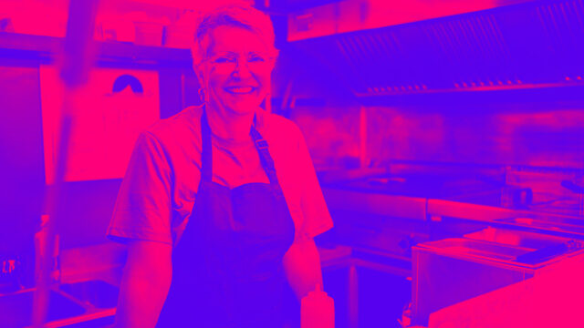 Portrait of smiling senior woman standing in food truck depicting Accept Apple Pay