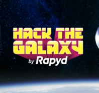 William Shatner Standing Next To The Hack The Galaxy Logo And A Space Ship...in Space!