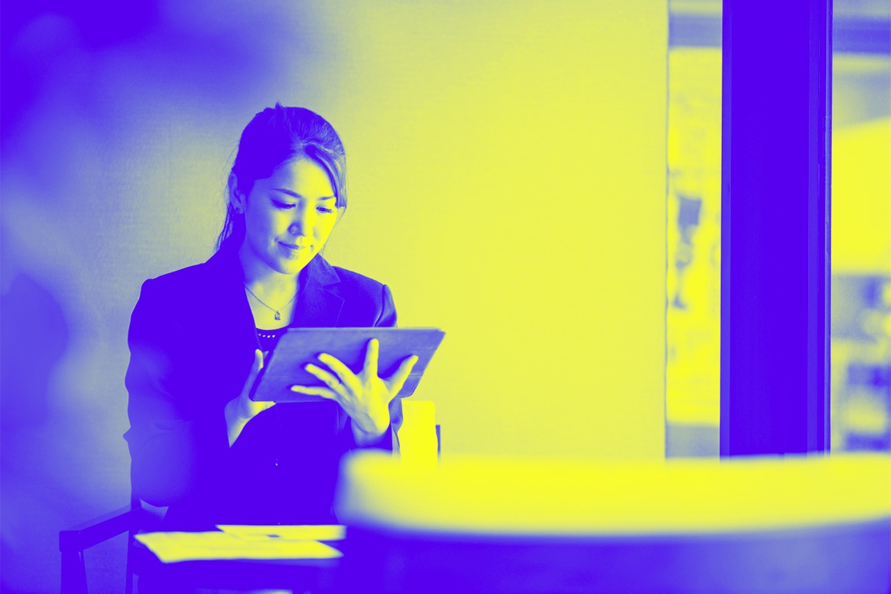 Businesswoman using digital tablet in office